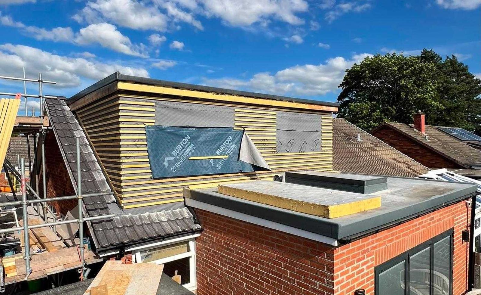 Dormer framed above a new brick extension with bifold doors, York