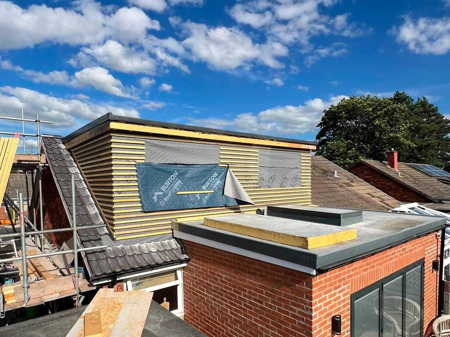 Dormer framed and insulated above a new brick extension