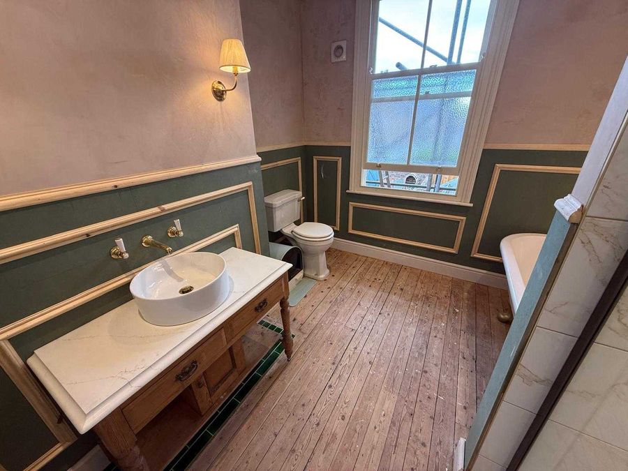 Marble vanity top and basin fitted onto a reclaimed washstand