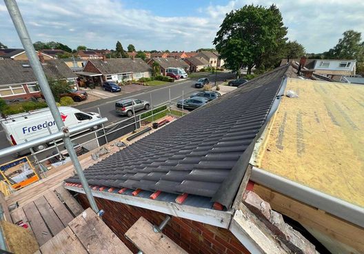 Roof stripped and re-covered on a bungalow, seen from the scaffold